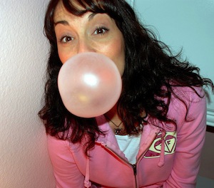 Chew gum to get better grades - photo of woman blowing bubbles