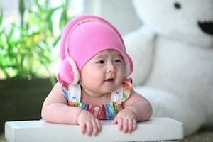 Eeh bah gum! You've got ear worms! Photo of baby wearing headphones