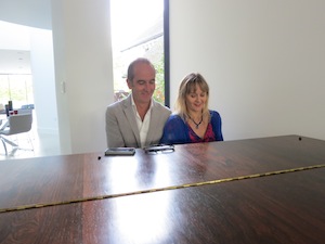 Photo of Lysette Offley and Kevin McCloud playing piano
