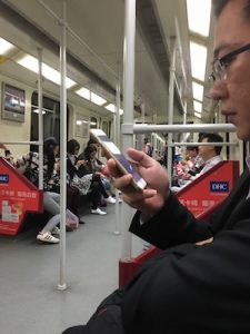 How to talk to strangers - photo of people focusing on their 'phones
